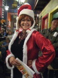 Photograph of poet Rita Geil dressed up as Mrs. Santa.