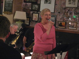 Image of Cindee singing at Comma Coffee