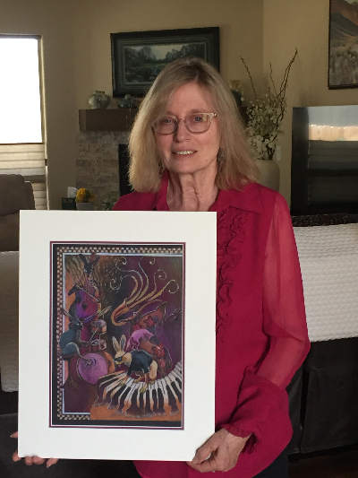 Photograph of Karen Kreyeski with 2020 winning artwork