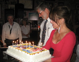 Photograph of David Bugli and June Joplin with anniversary cake.