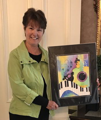 Photo of Reta Hanks with winning 2019 artwork