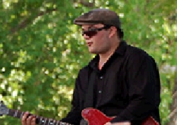 Photograph of Tristan
  Selzler with Guitar